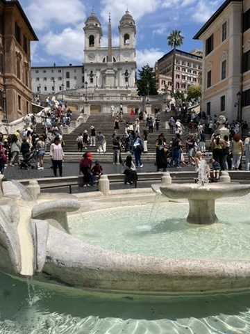 Spanish Steps Rome with tourists enjoying the morning view