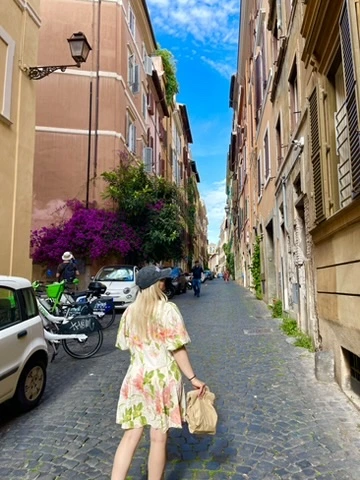 Traveler walking in colorful Trastevere streets in Rome
