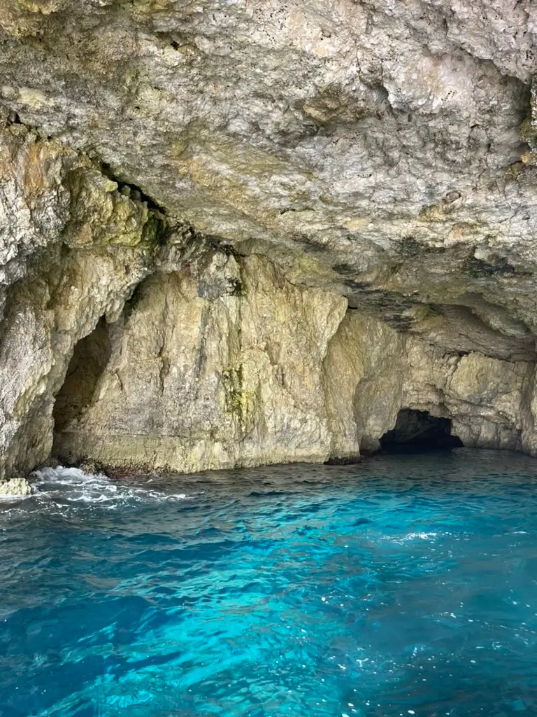 Malta sea caves turquoise water boat tour