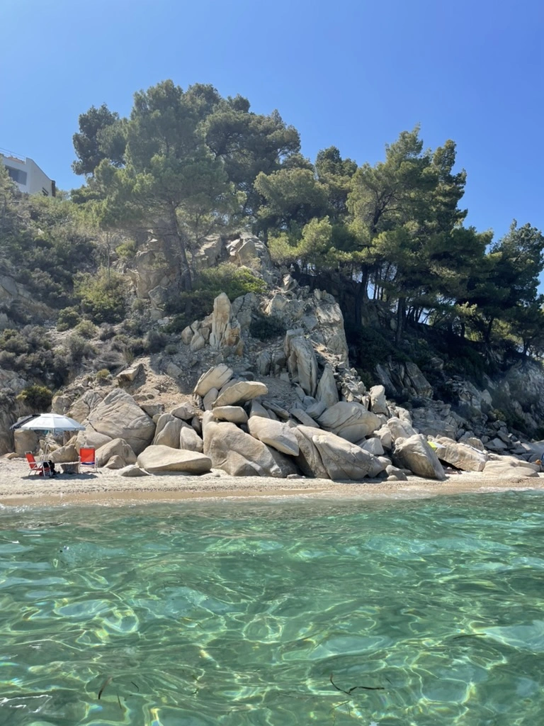 Fava beach Halkidiki crystal clear turquoise water with dramatic cliffs